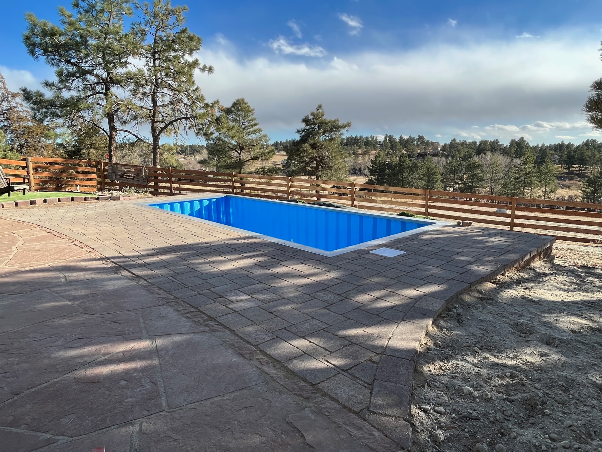 paver pool deck around container pool 
